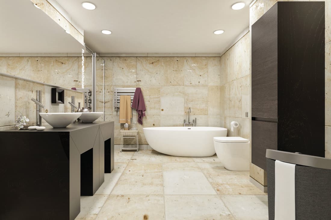Large modern bathroom with a natural stone finish