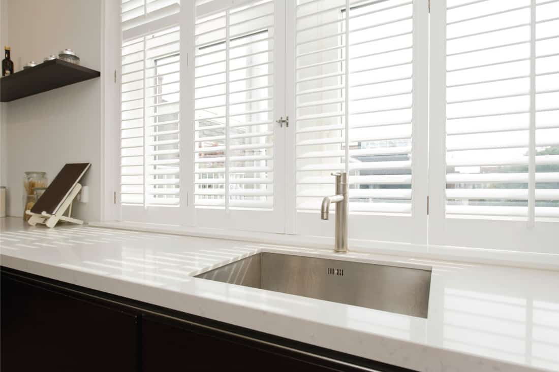 modern kitchen top with white wood blinds
