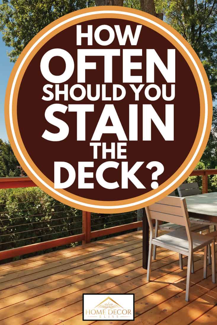 Outdoor dining in a beautiful wooden deck, How Often Should You Stain The Deck?