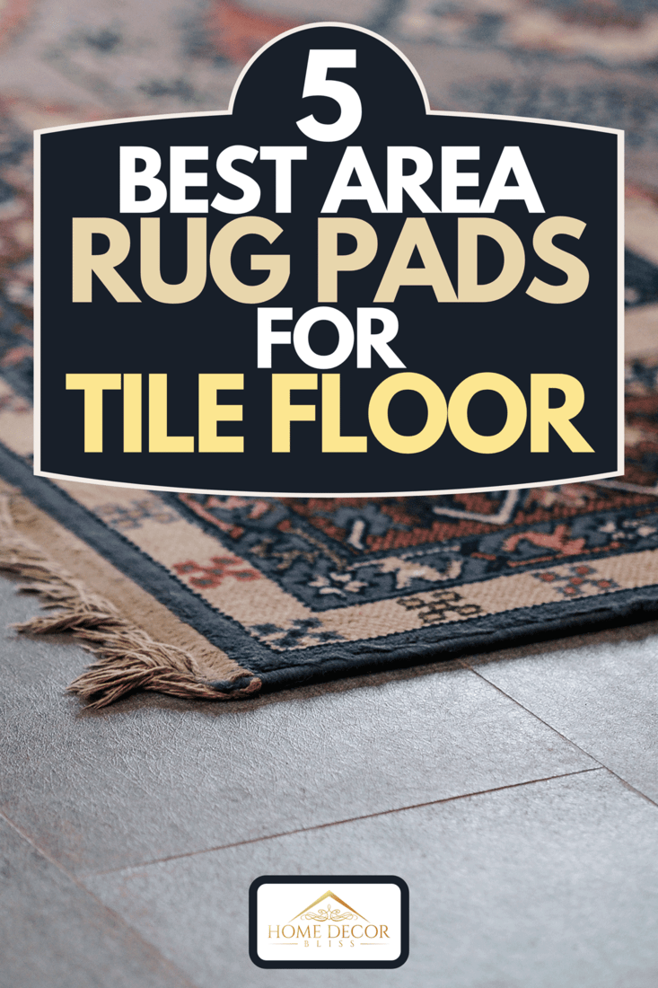 An ornamental design carpet on gray tile floor, 5 Best Area Rug Pads For Tile Floor
