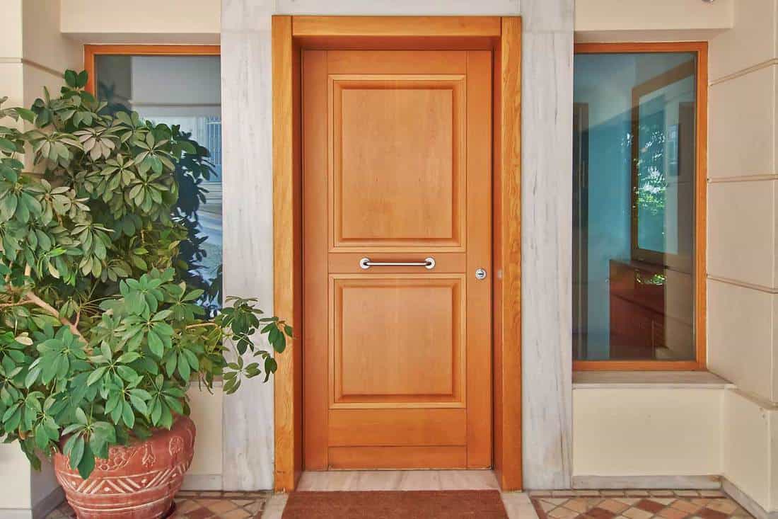 A contemporary wooden house door, 10 Types Of Door Sweeps And Bottom Seals