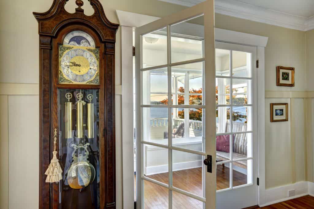A gorgeous grandfather clock inside a vintage styled living room 