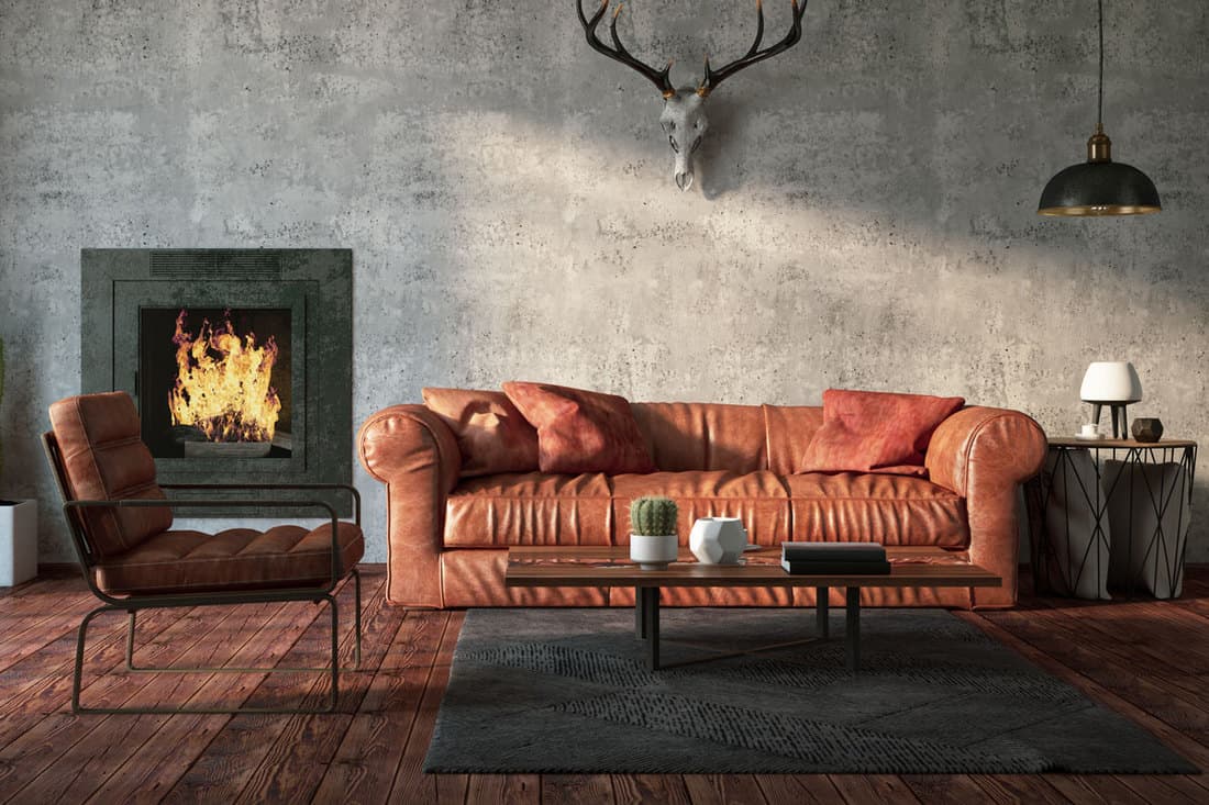 A Natuzzi leather sofa inside a ranch inspired living room with hard wooden flooring, How To Care For Natuzzi Leather Furniture