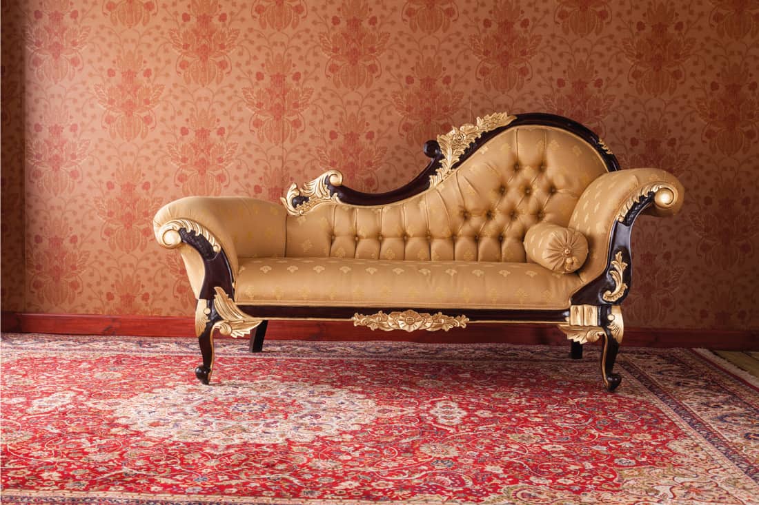 An ornate chaise longue in an upper class drawing room