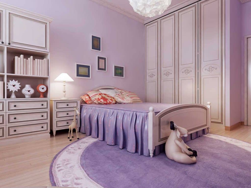 Art decor in a cozy purple bedroom interior