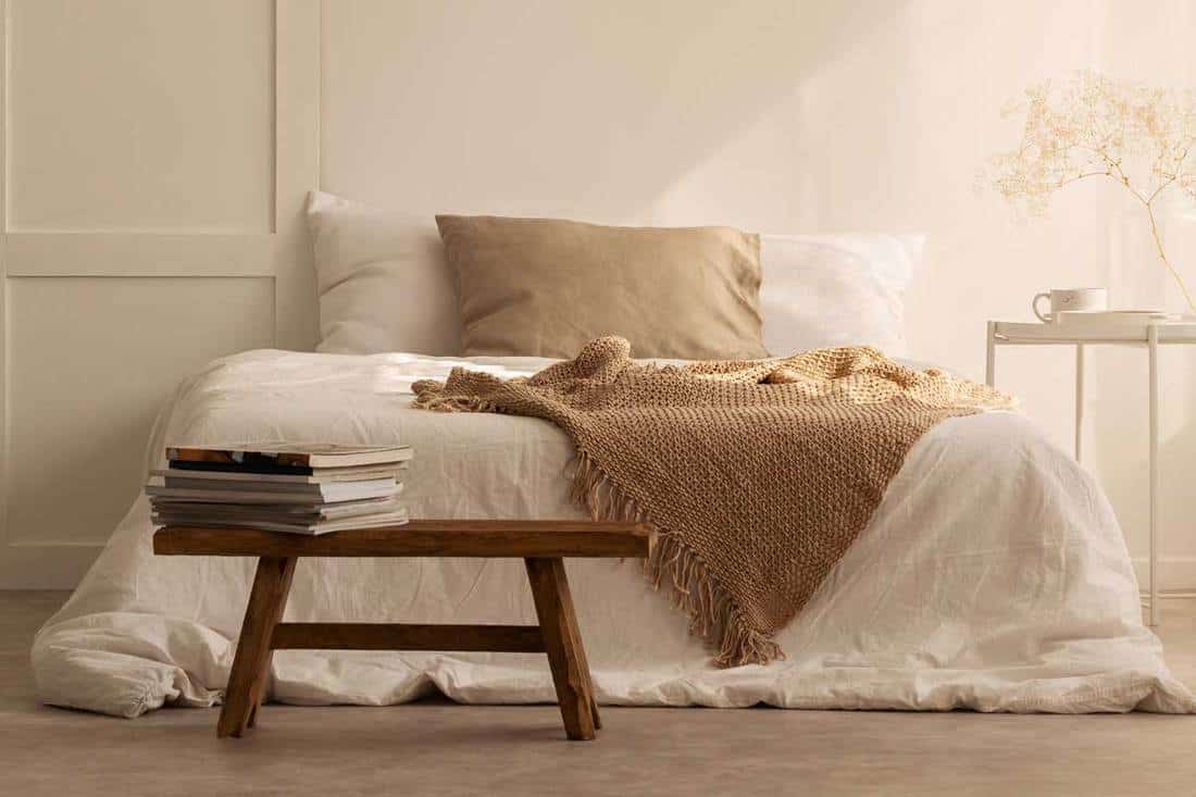 Beige blanket on the double bed in stylish wabi sabi bedroom of minimal style house, How Long Do Flannel Sheets Last?