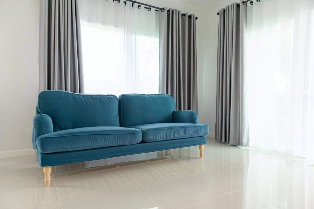 Blue sofa in living room interior home background 