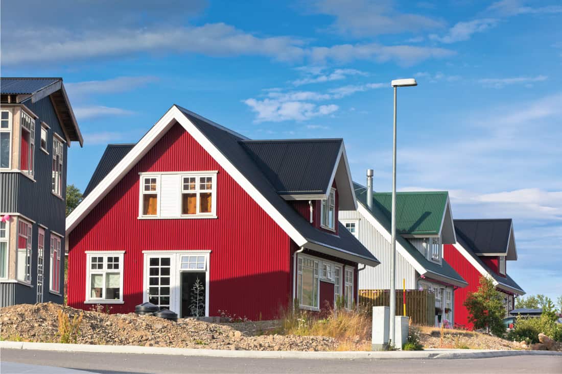Bright red vinyl siding houses in small town