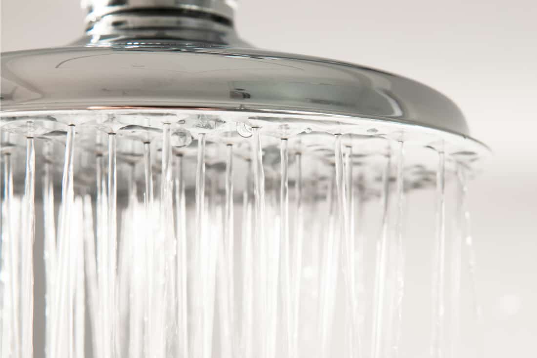 Close-up of water falling from a chrome shower head