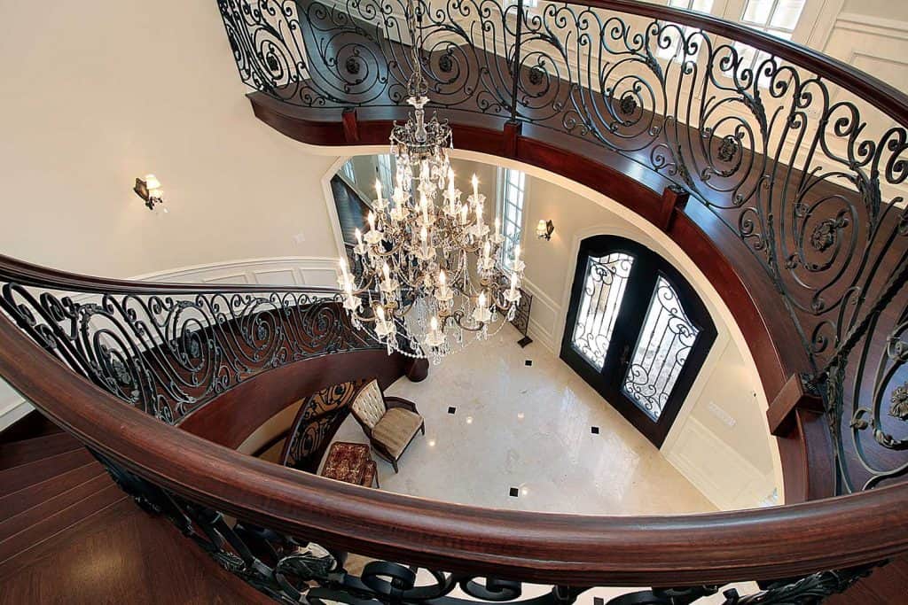 Curved stairway leading down into foyer