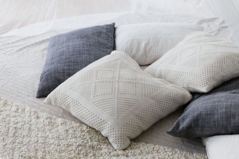 Different colors of cushions photographed in the bedroom, 5 Types of Cushion Stuffing and Filling