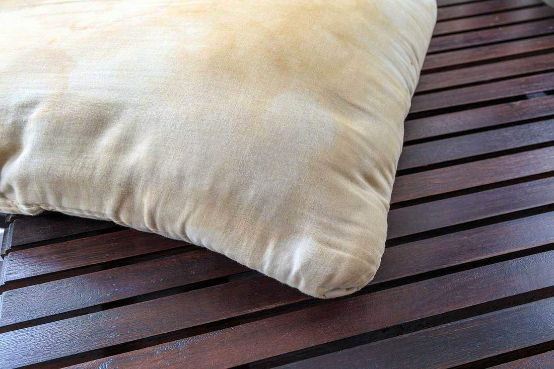 Dirty pillow on wooden table