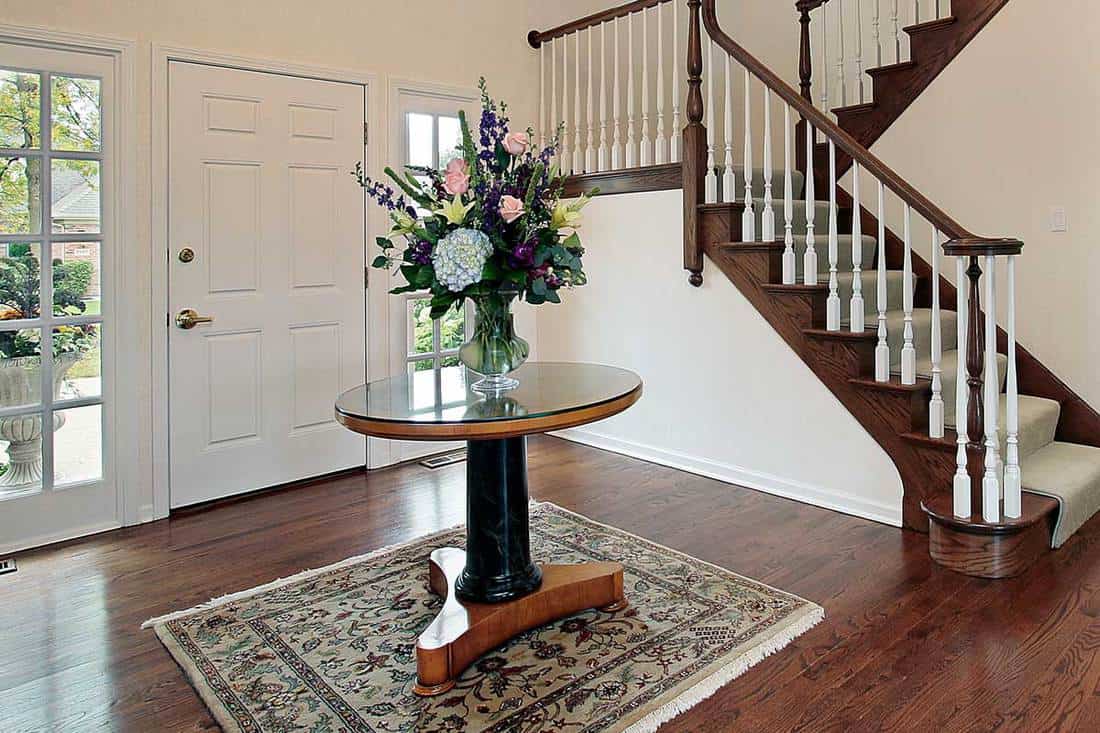 Foyer with center table on carpet rug, 11 Foyer Rug Ideas You're Going to Love