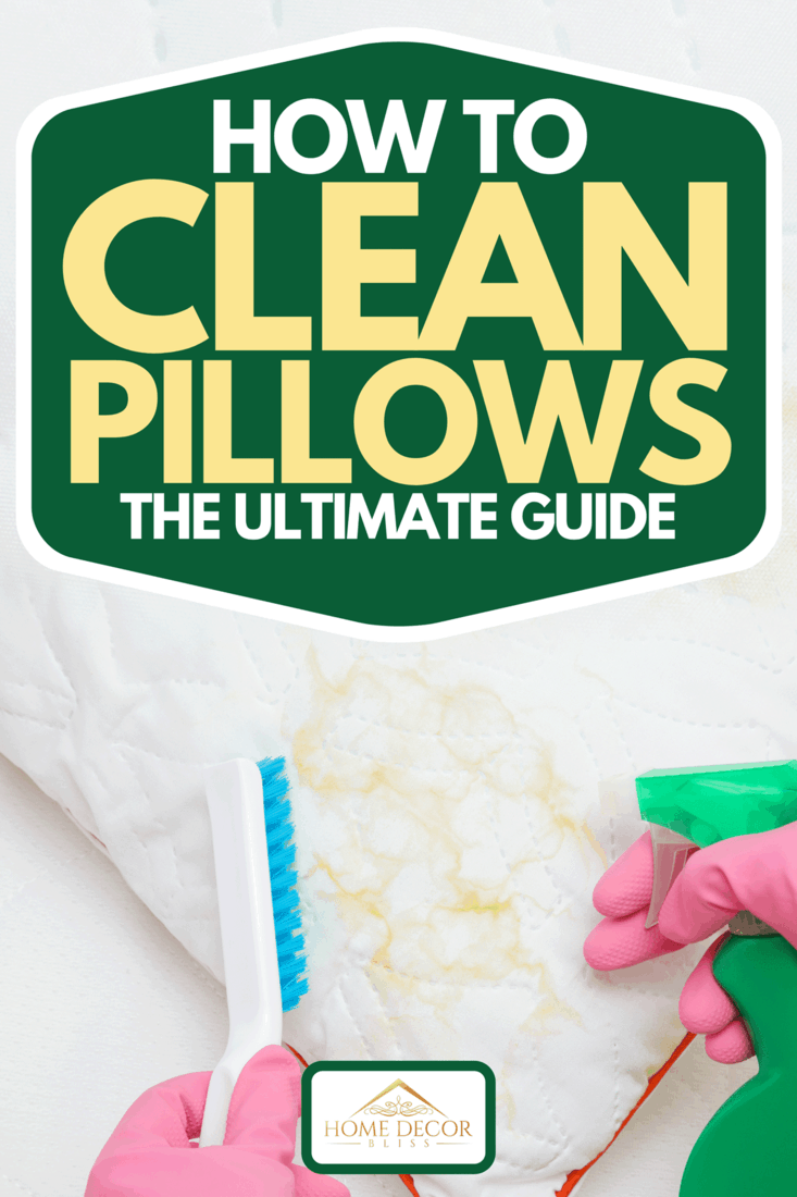 A dry cleaner's employee hands in rubber protective gloves holding spray bottle and brush removing saliva stain from white pillow, How To Clean Pillows: The Ultimate Guide