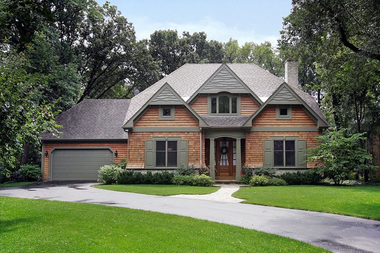 Huge two storey mansion with wooden sidings and gray roofing shingles, Huge Sequoia tree next to a home with country home, How Much Does Wood Siding Cost Per Square Foot? (By Type Of Wood)