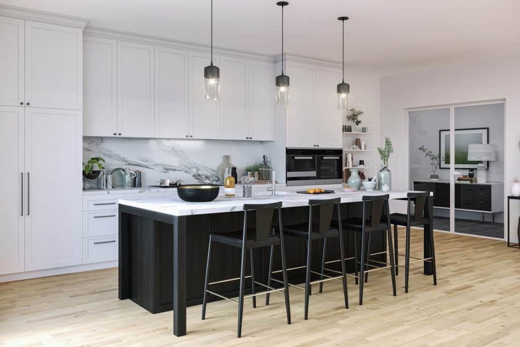 Interior of a contemporary inspired kitchen with a black and white mixed breakfast bar, and white paneled cabinetry