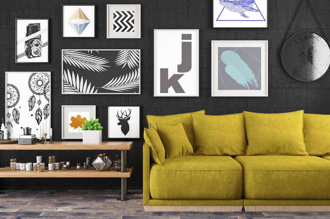 Interior with sofa, coffee table and black wall artwork, How To Choose Artwork For Living Room