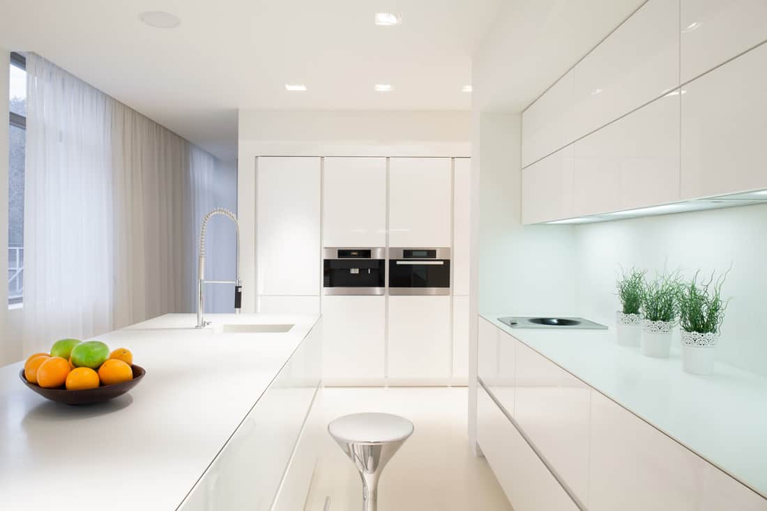 Luxury white cabinets with white countertops