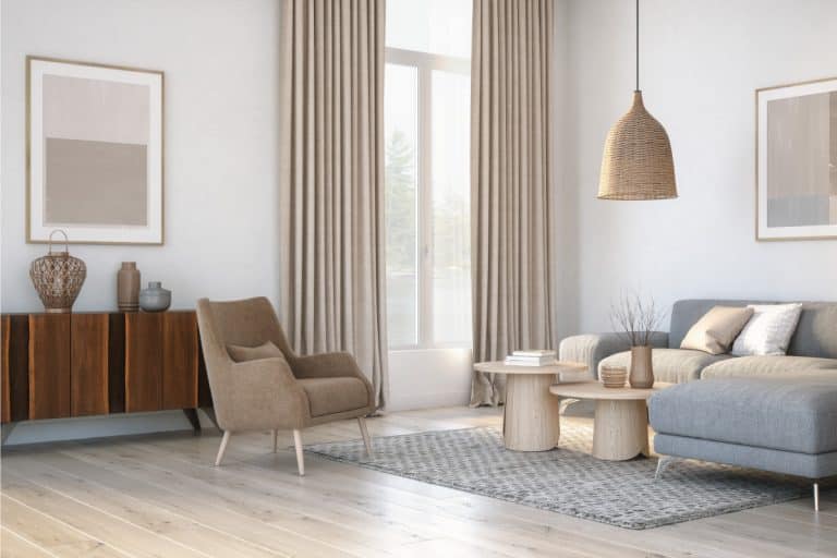 Scandinavian interior design living room with gray and beige colored furniture, cream colored curtains, and wooden elements, What Curtains Go With Gray Carpet?