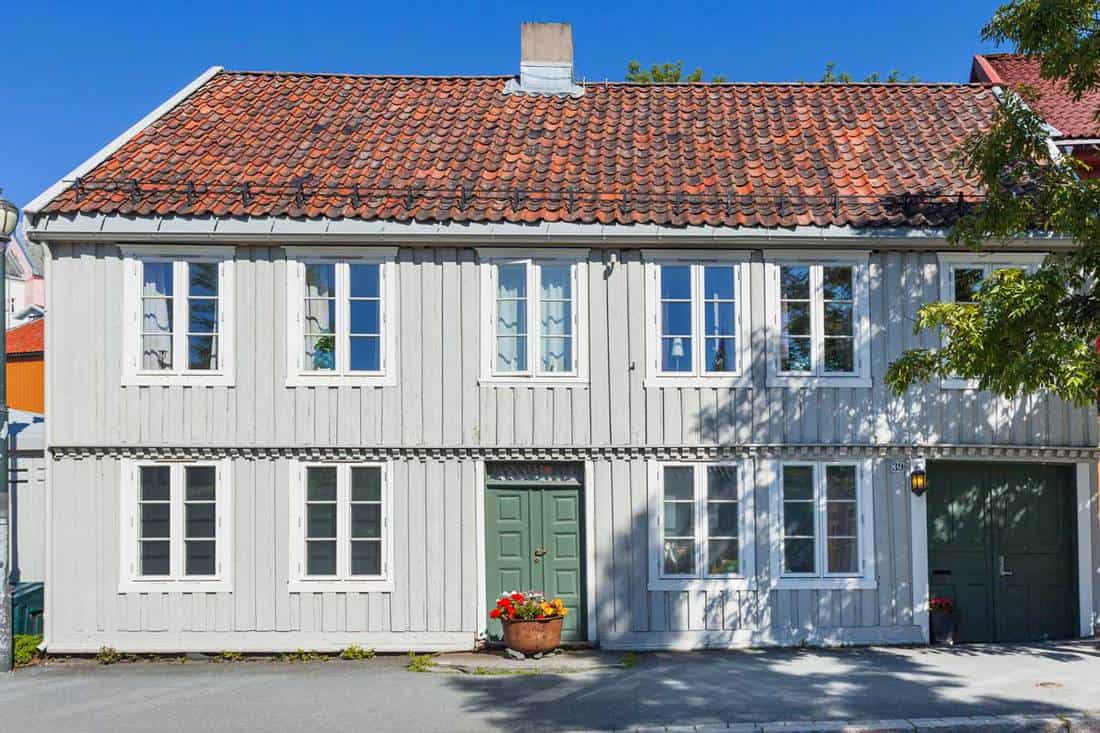 Scandinavian style apartment building with board and batten siding, How Long Does Board And Batten Siding Last?