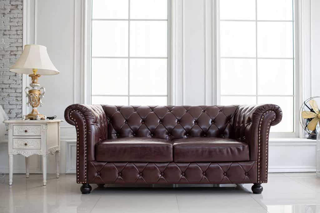 Vintage style of interior decoration the leather sofa in white room