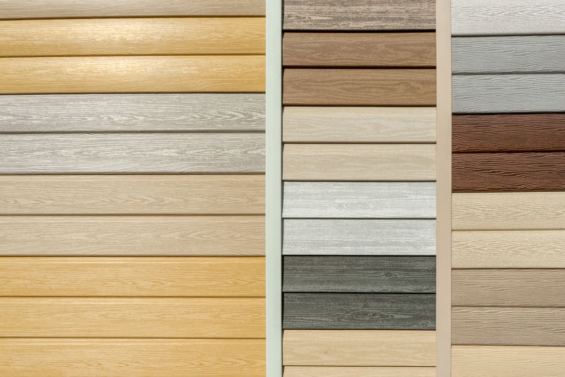 Vinyl siding with imitation wood texture in bright palette of colors