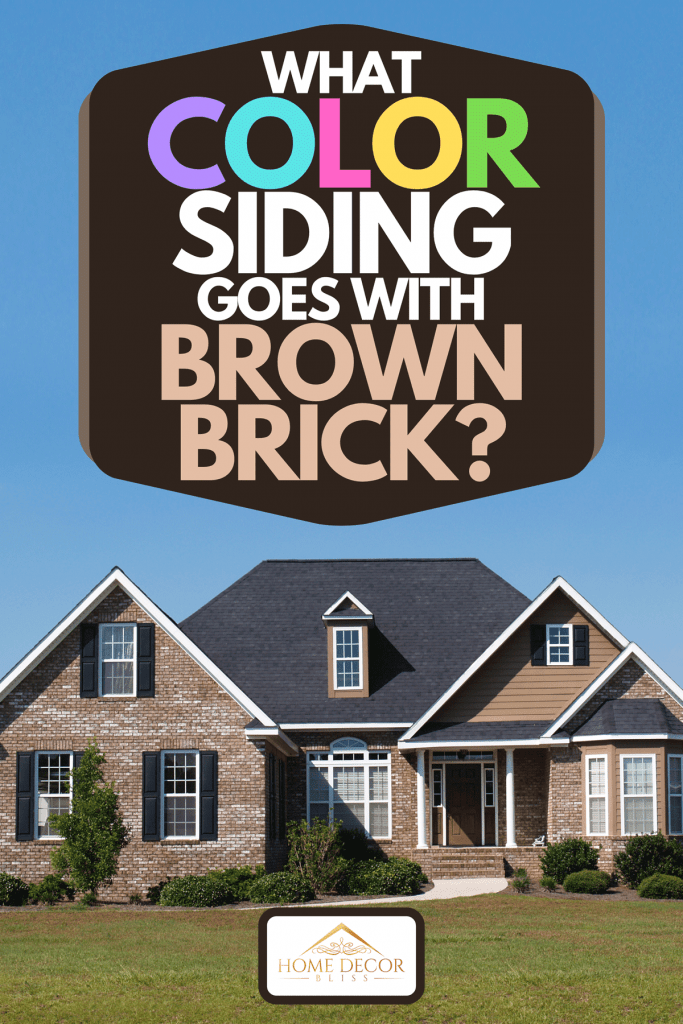 A small two story brick home with porch and a garage on the side, What Color Siding Goes With Brown Brick?
