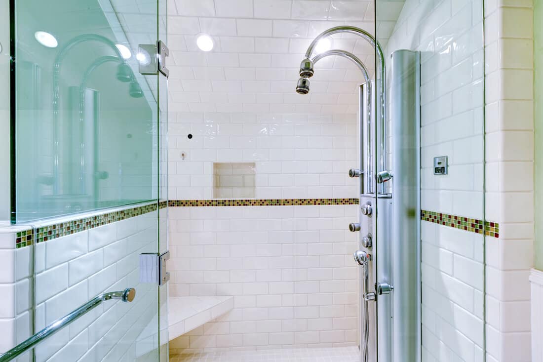 White large luxury bathroom walk-in shower with steam modern system. 