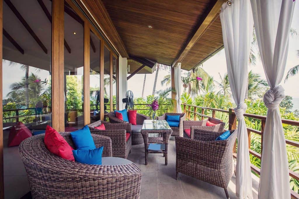 Wicker furniture on veranda balcony in modern interior design