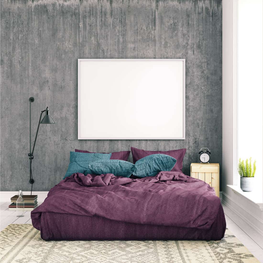 Basic bedroom interior with pastel colored bed with pillow, gray concrete wall, floor lamp, carpet and a plant