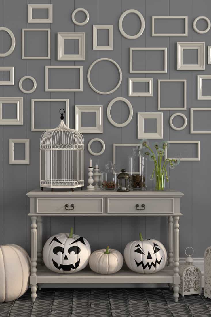 Beige console table with decorations for Halloween