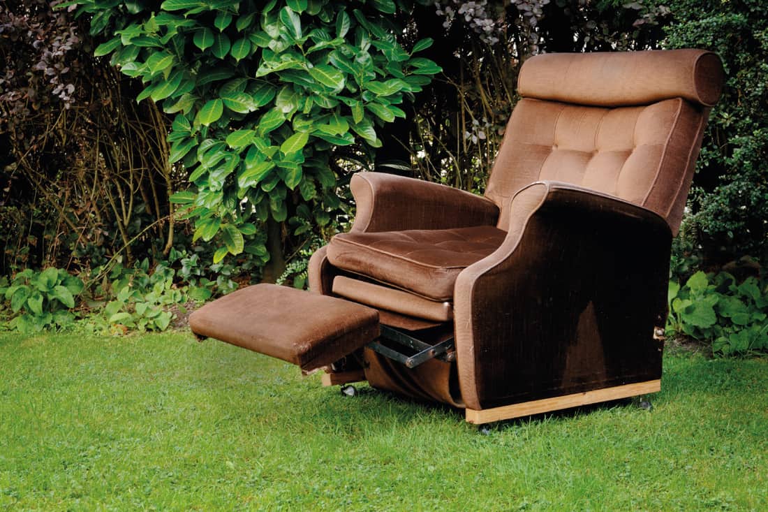 Brown corduroy reclining chair in a garden outdoors, 5 Best Recliners For Tall People