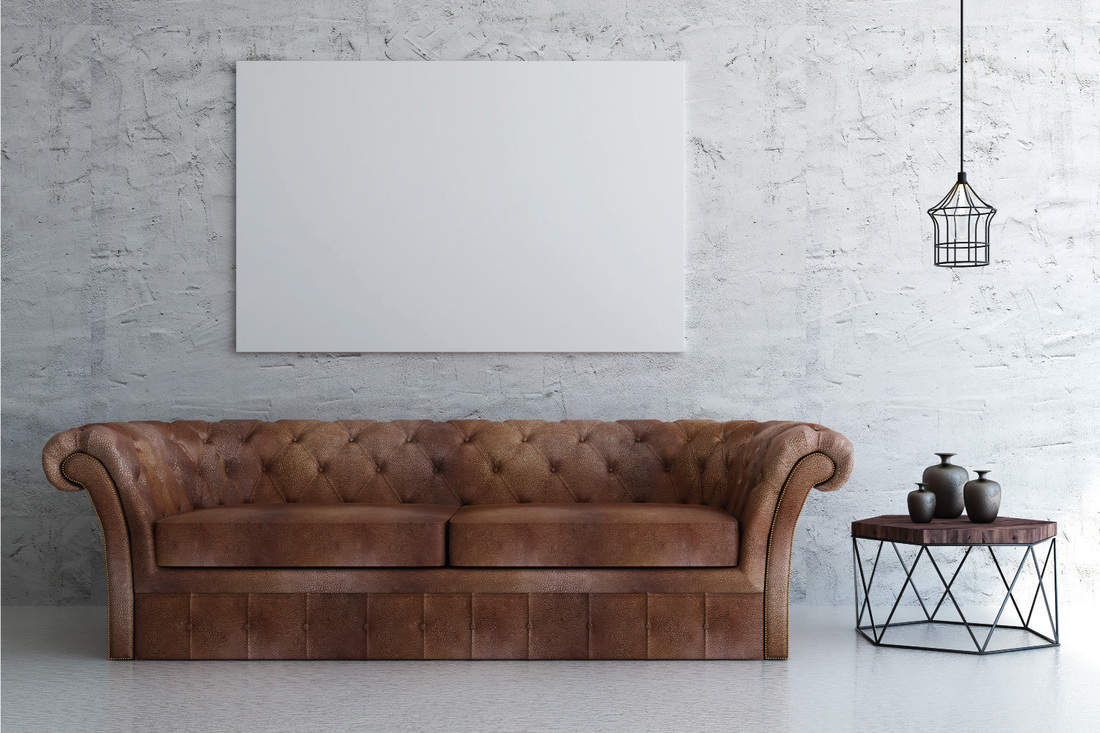 Transitional brown leather couch on an empty modern living room