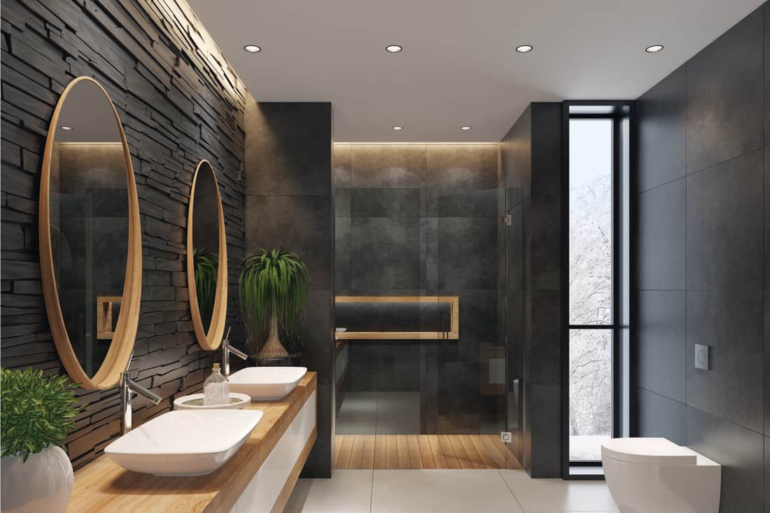 Contemporary minimalist bathroom with two round mirrors and wooden frame