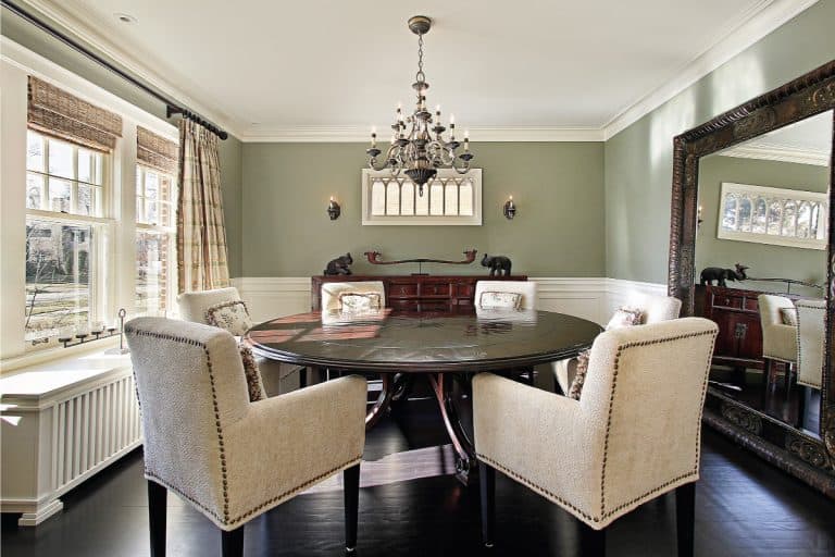 dining room with olive colored walls and pull down blinds on the windows, 11 Dining Room Window Treatments Ideas