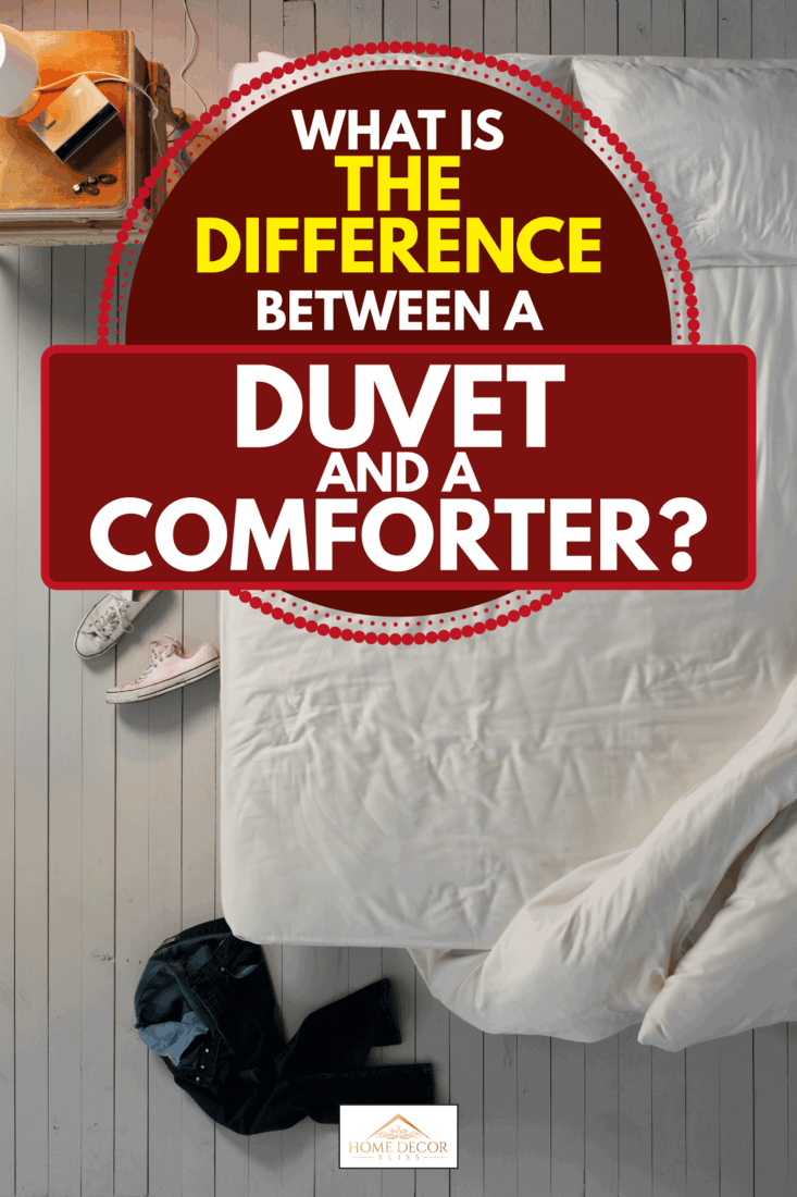 Empty bed with duvet comforter hanging by the corner, pants and shoes on the bedroom floor, What Is The Difference Between A Duvet And A Comforter?
