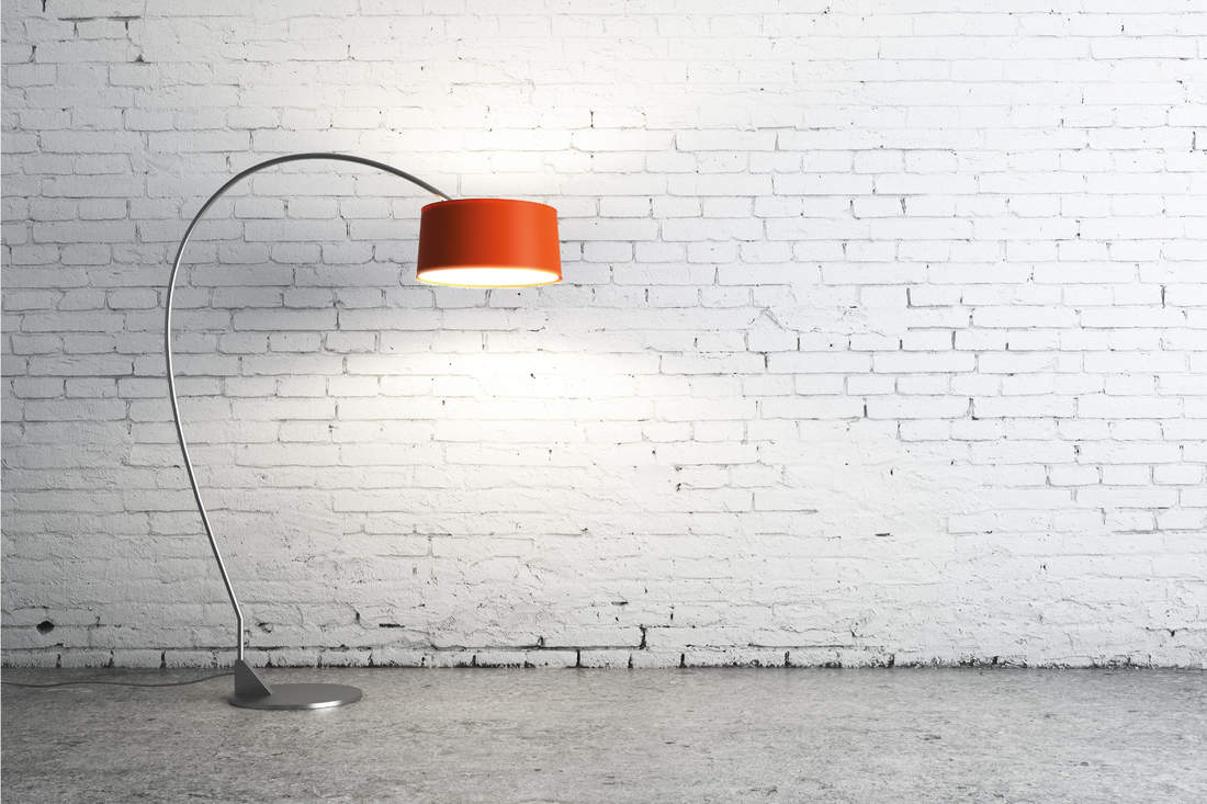 floor lamp with red shade in an empty living room