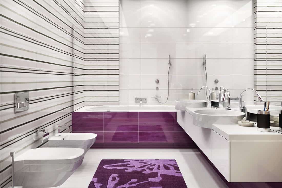 Large white bathroom with striped wall tile design