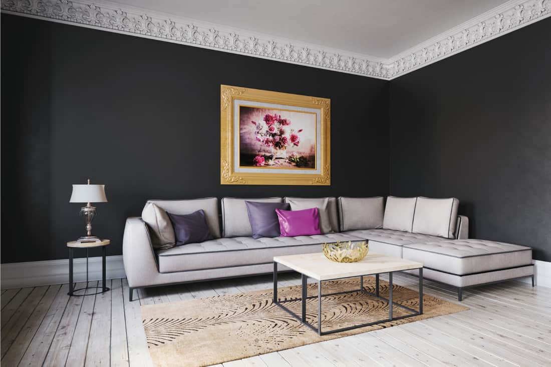 Mix of dark and light gray living room with a standout single accent pillow in pink