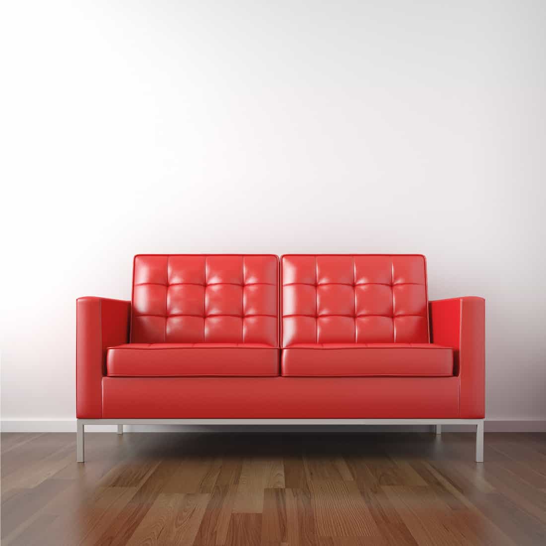 Modern classic red leather sofa in a white room