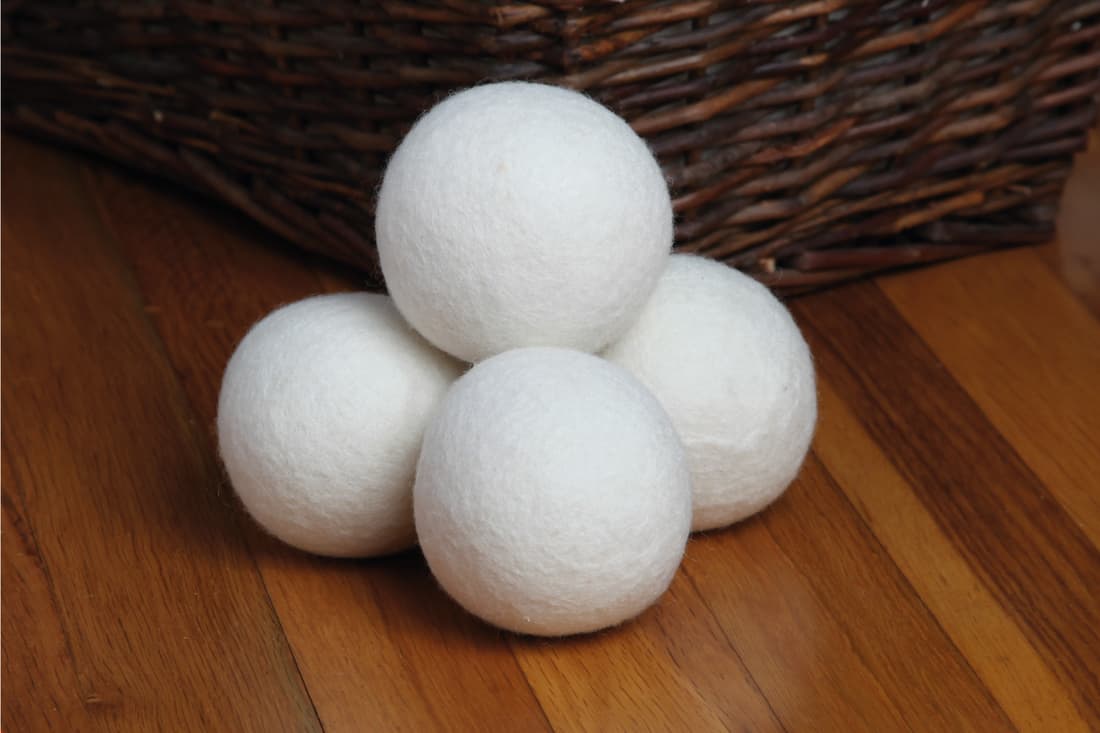 Sheep dryer balls on top of wooden table