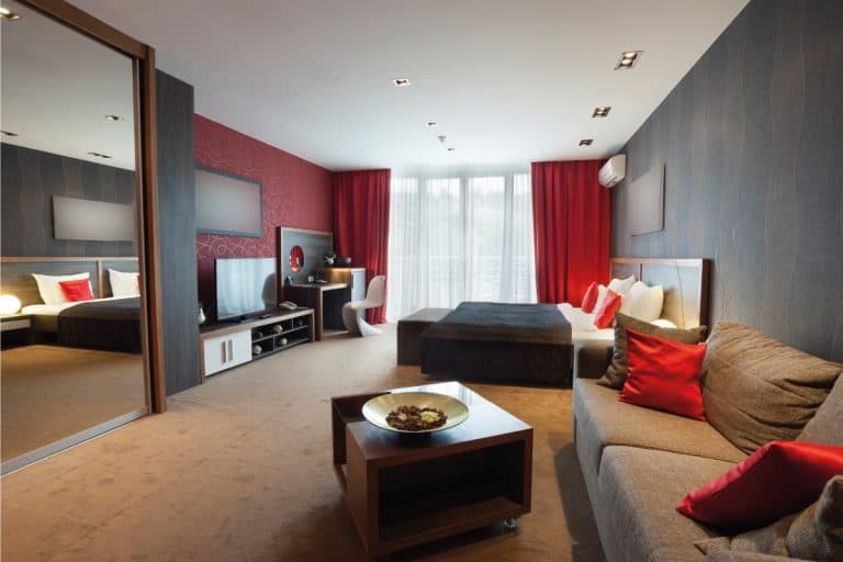 Studio type room with red curtains and black theme, 13 Red Curtain Ideas For your Home