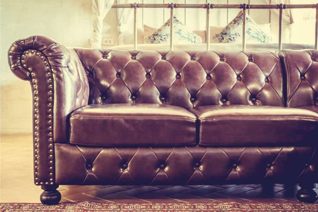 Vintage leather sofa in light sepia colors