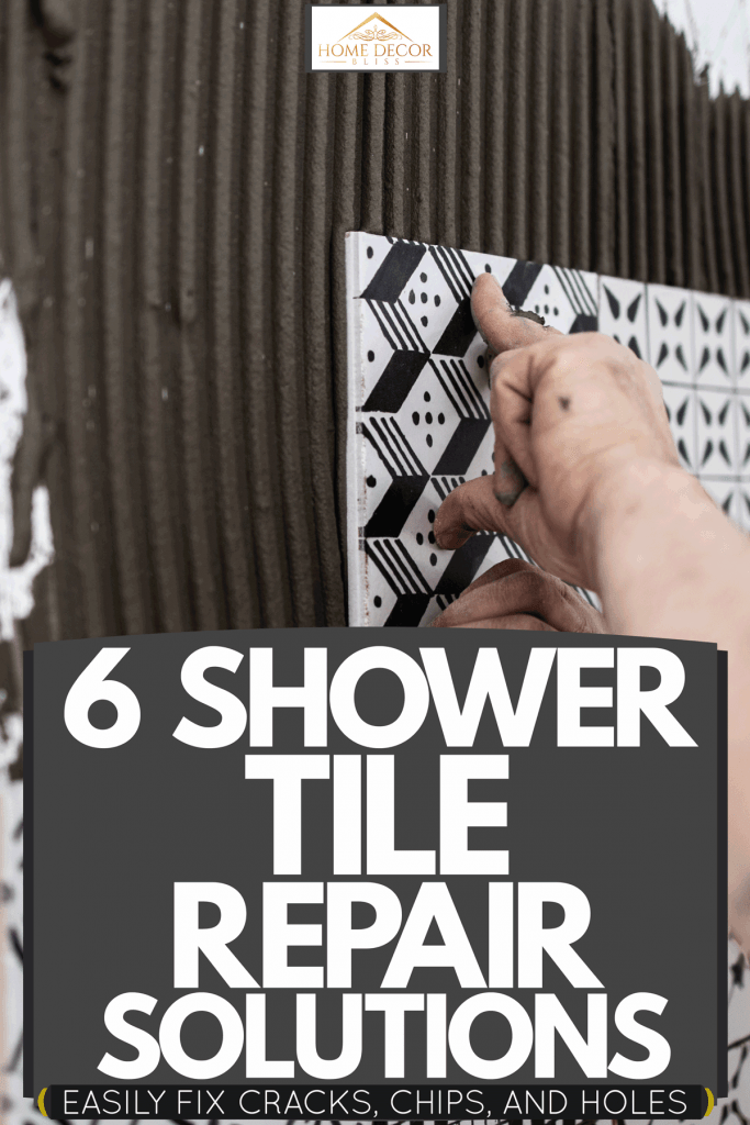 A tile setter placing patterned tiles on the wall of the bathroom, 6 Shower Tile Repair Solutions [Easily Fix Cracks, Chips, And Holes]