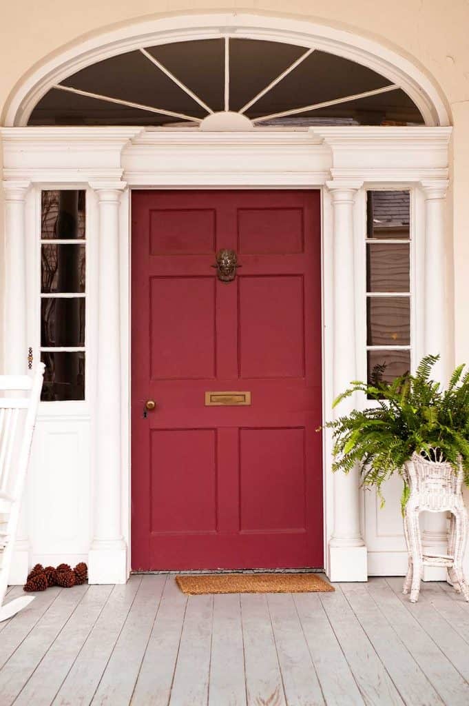 A beautiful front door on a wooden front porch
