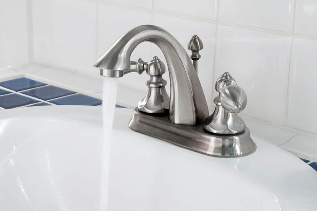 A brushed nickel finish bathtub faucet