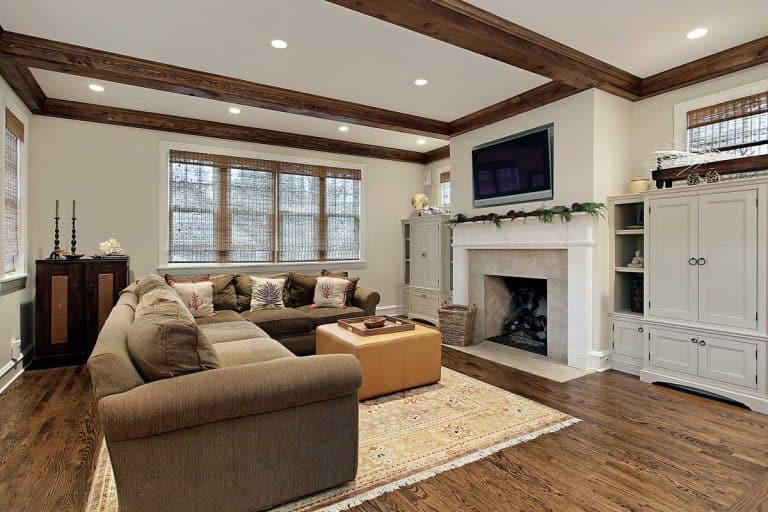 A family room with wood ceiling beams, Should Ceiling Beams Match The Floor?
