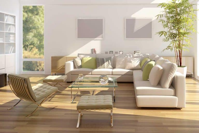 Modern living room with white L shape sofa, large glass doors and windows, What Furniture Goes With Bamboo Floors?