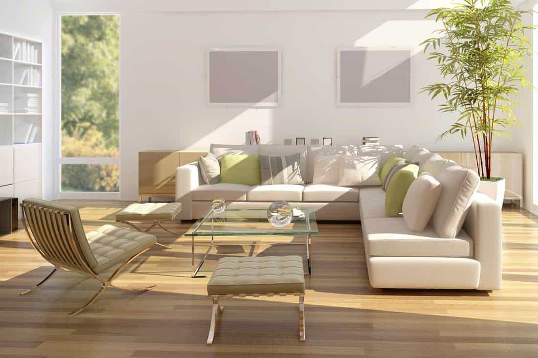 Modern living room with white L shape sofa, large glass doors and windows, What Furniture Goes With Bamboo Floors?
