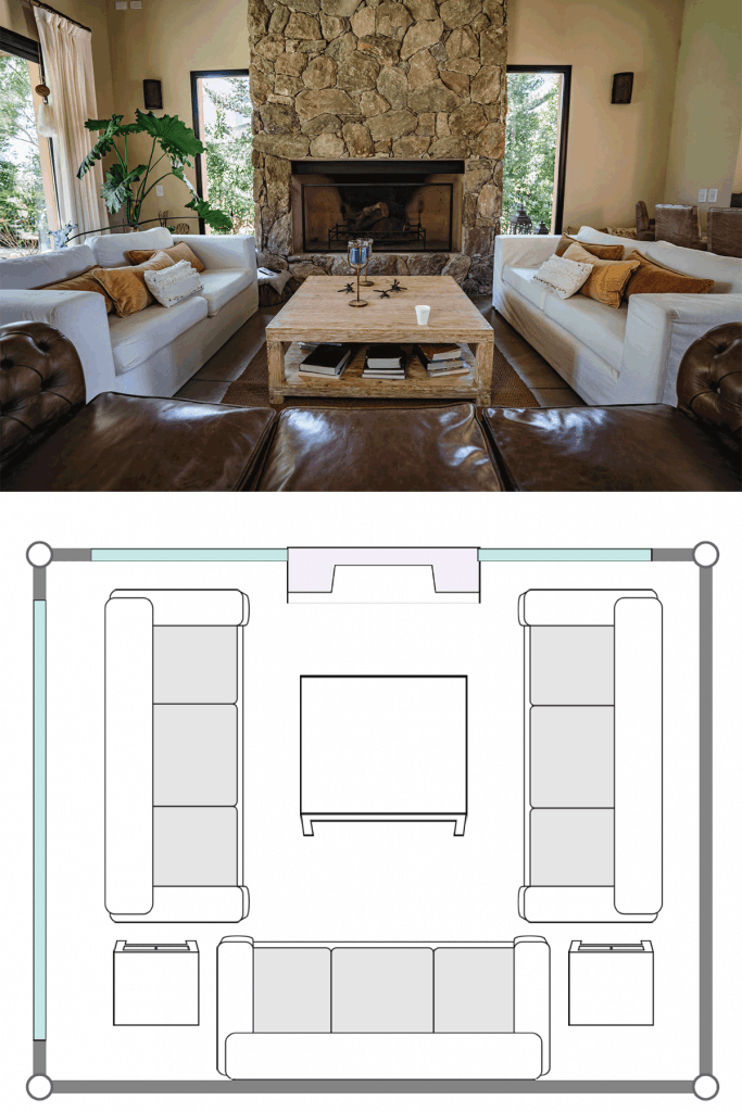 Un salon spacieux avec deux canapés blancs, des coussins, une table basse au centre avec une cheminée en arrière-plan